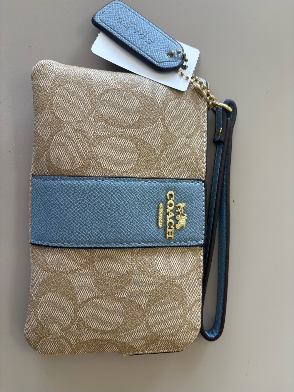 Source Unknown Beige Signature Canvas Wristlet with Light Blue Trim